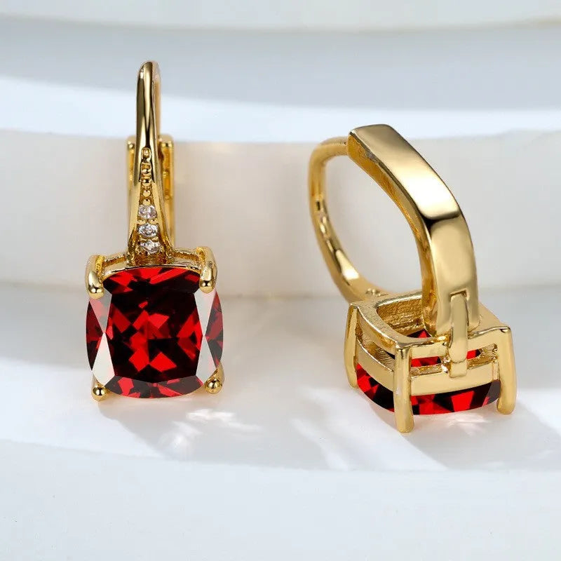 Square geometric ear hook studs with a round zircon stone, shown in a gold electroplated finish.
