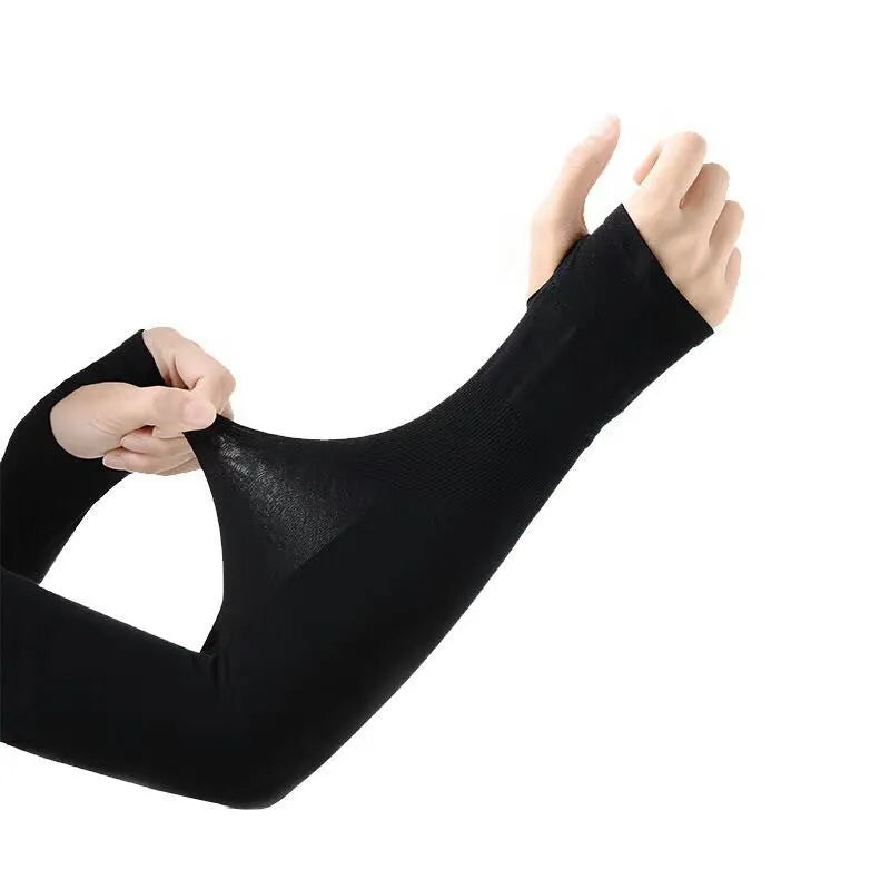 Unisex black sun protection driving sleeve with open finger design on an arm.