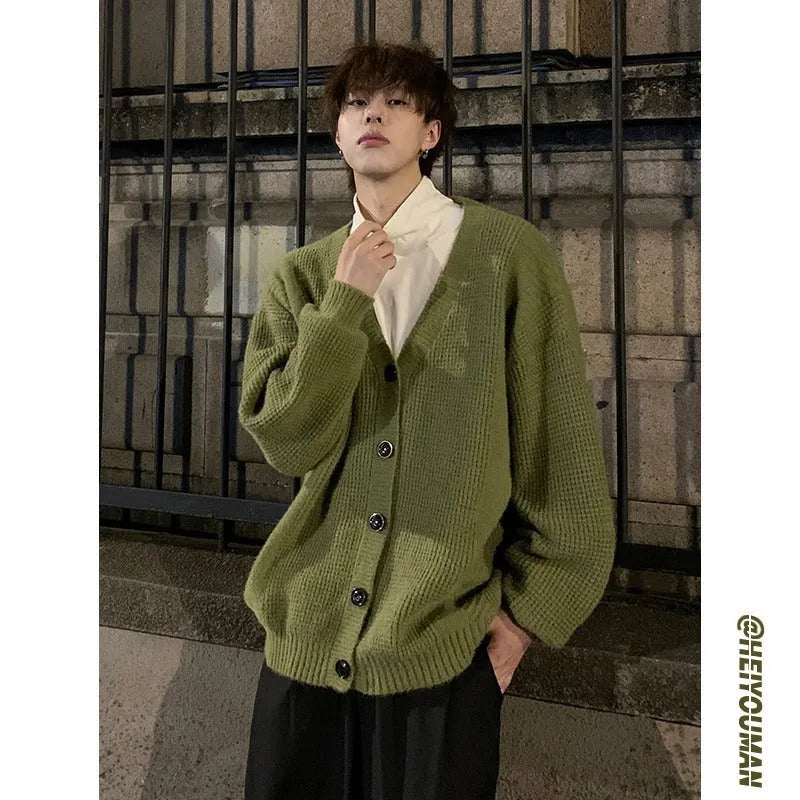 Men's loose-fit V-neck cotton-blend cardigan in army green, shown on a hanger.