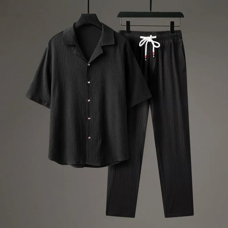 Men's national style two-piece sportswear set showing knitted half-sleeve top and full-length trousers