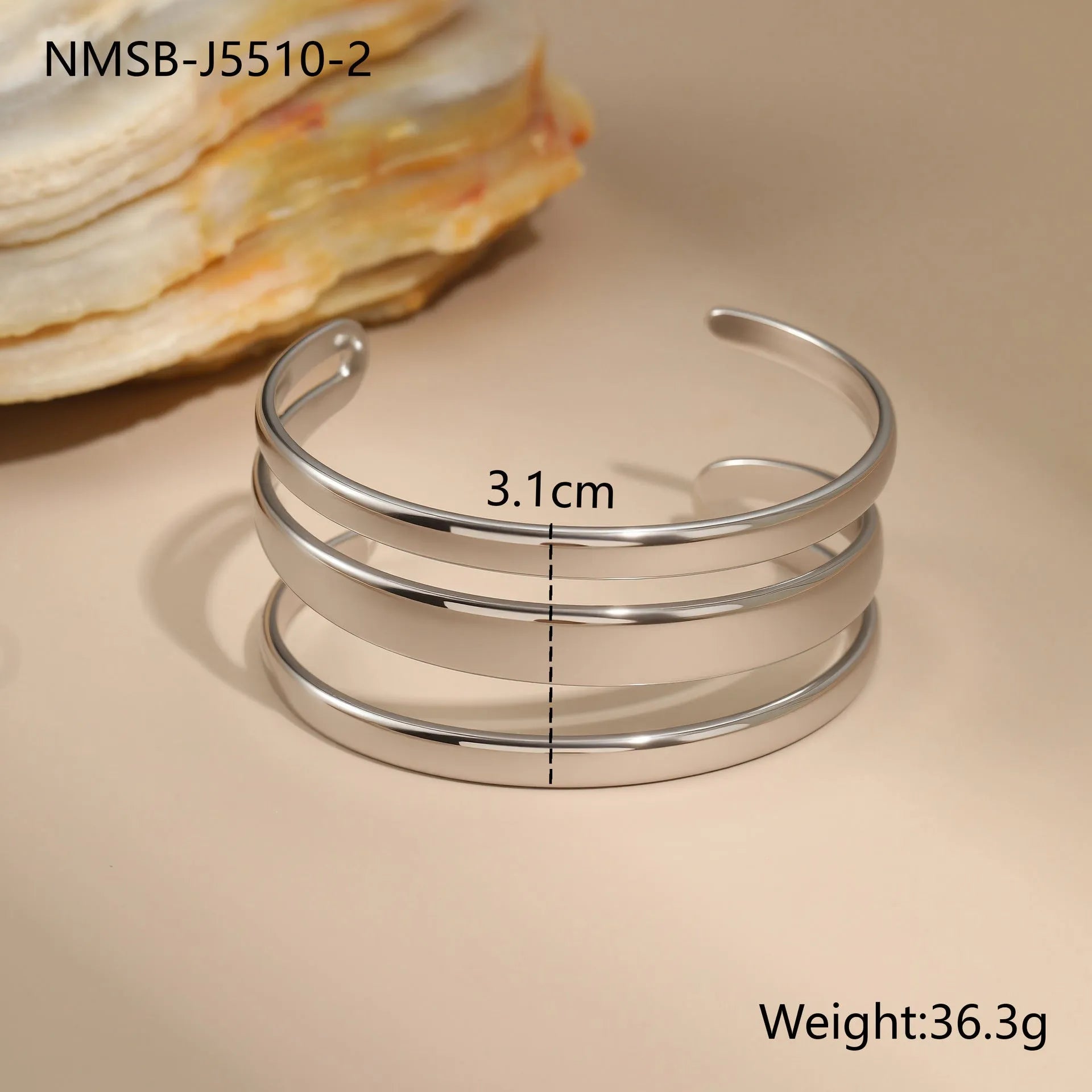 A geometric stainless steel bracelet with a simple opening clasp, shown in a gold electroplated finish.
