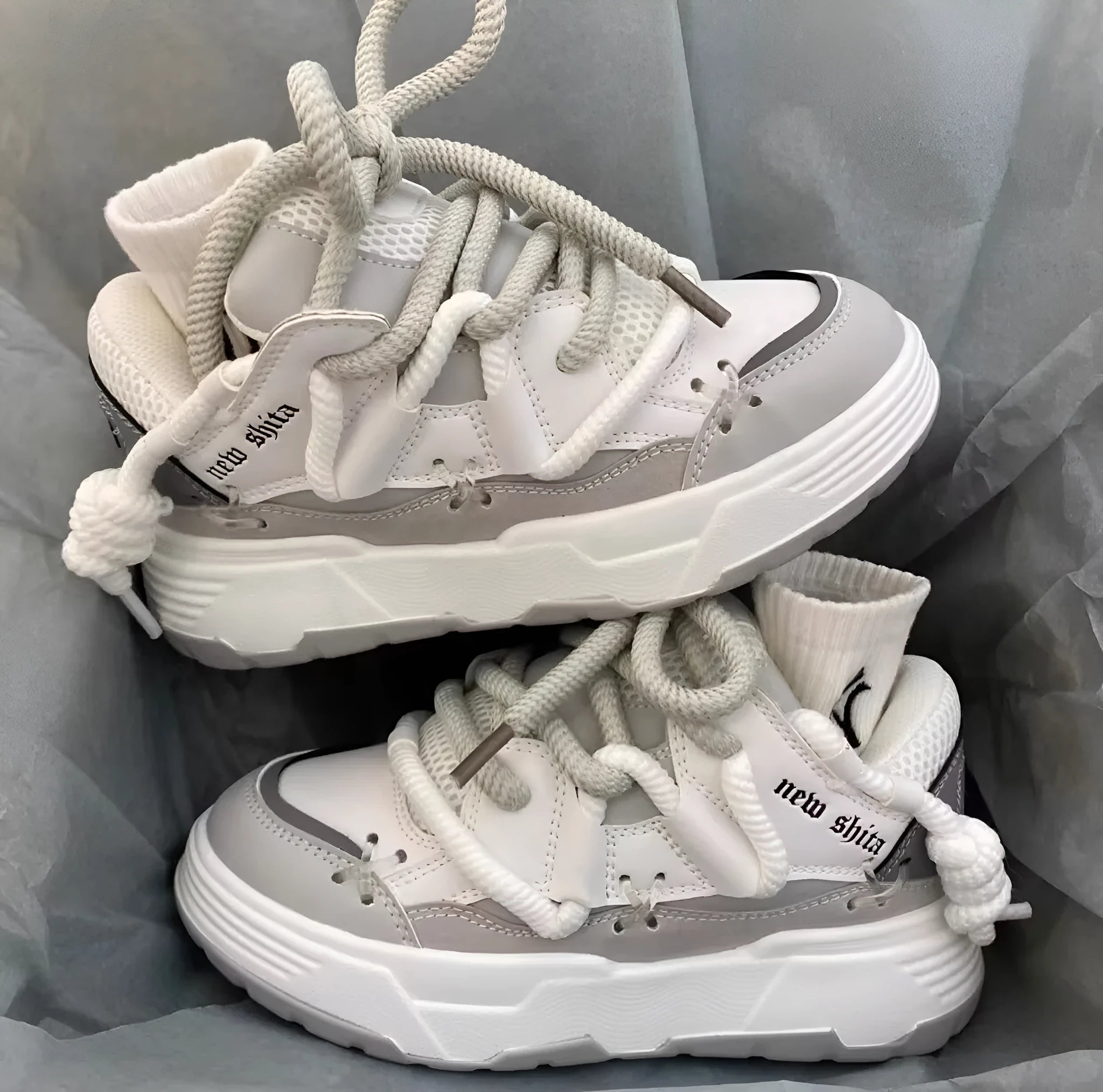 Women's grey retro clunky sneakers with thick rubber sole and lace-up front, showing 6-8cm heel height