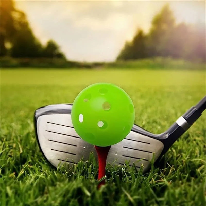 Multi-colour 42mm golf practice balls in red, blue, green, orange, white, and yellow in a net bag