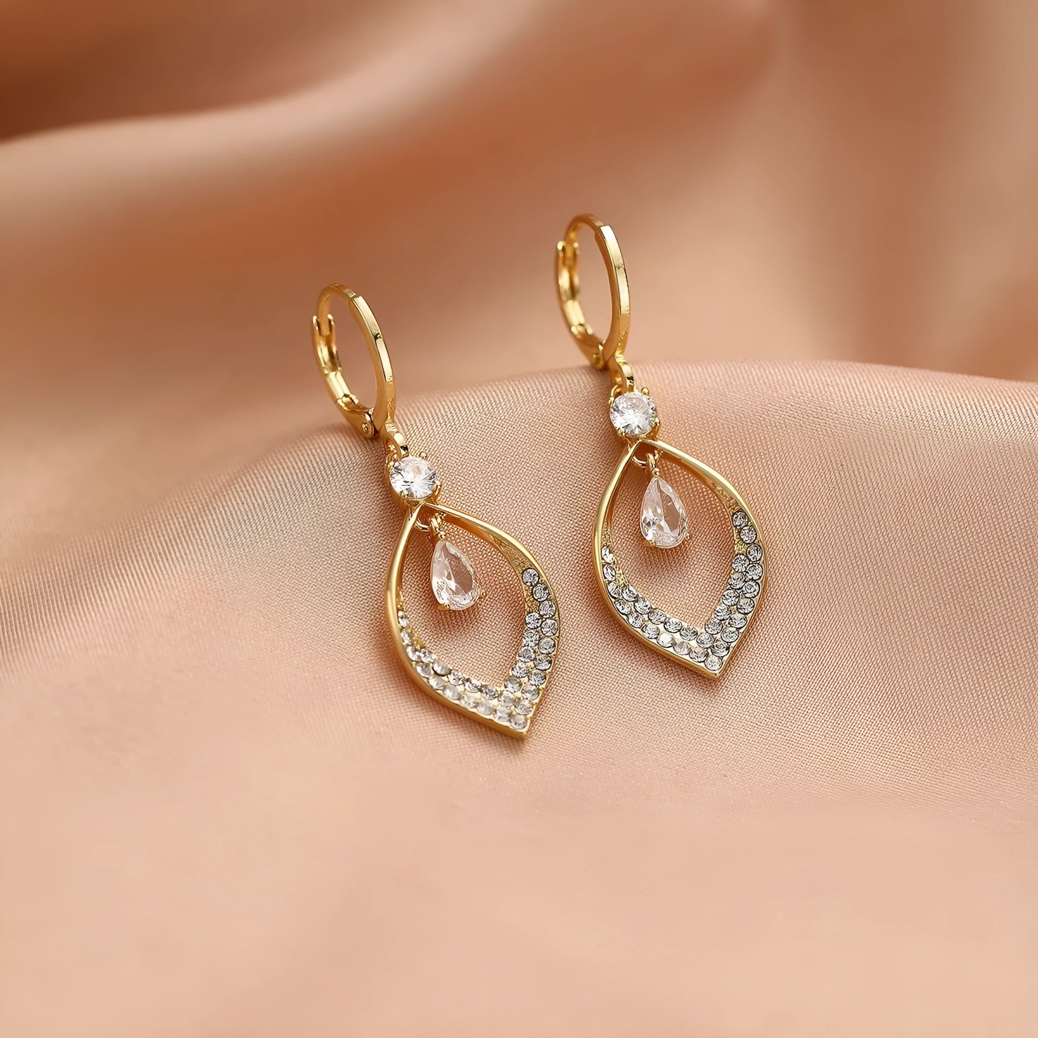Copper water drop tassel earrings with a zircon stone and gold or silver ear buckles.