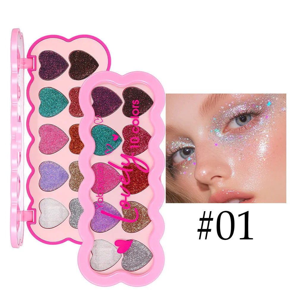 Heart-shaped ten-colour eye shadow palette with pearlescent sequin finishes in white, beige, pink, purple, brown, blue, black, royal blue, maroon, and coral.