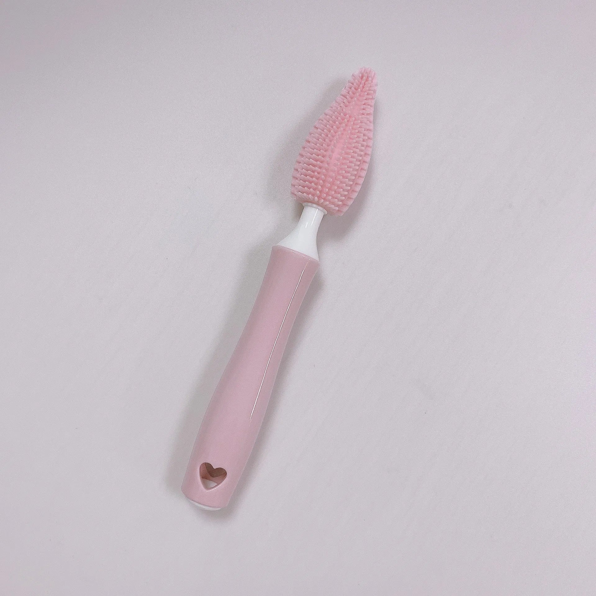 Silicone baby bottle brush set with main brush and separate straw cleaner in pink, blue and yellow colours.