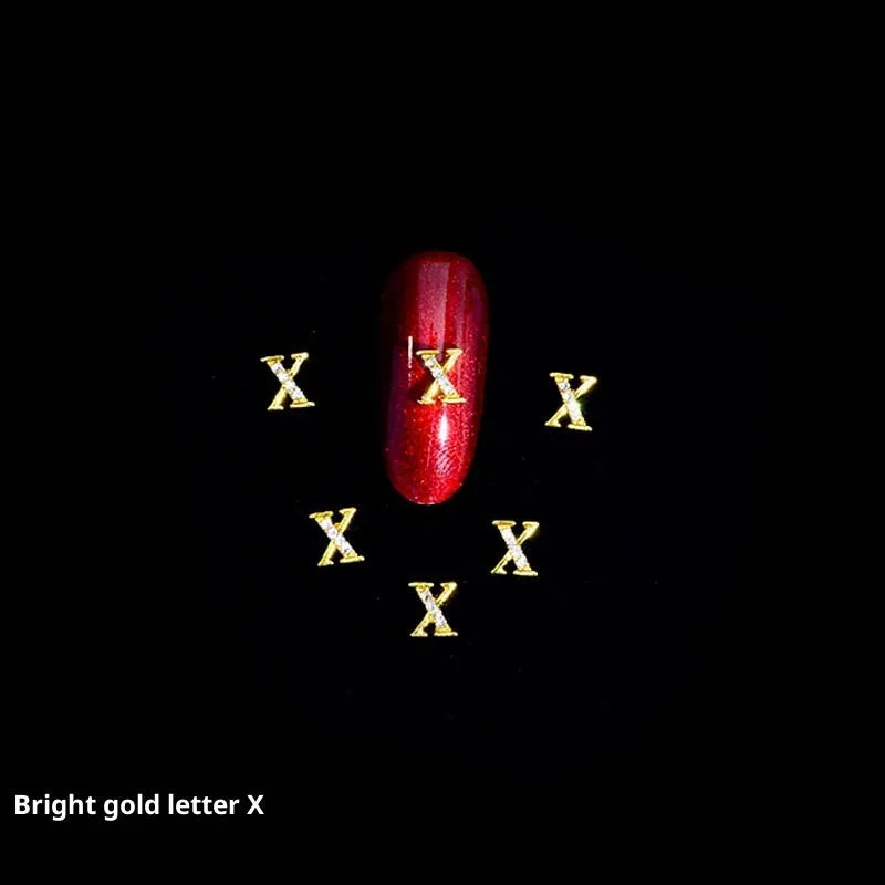 Gold alloy letter A nail ornament charm with crystal detail on a square chain base