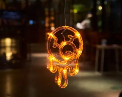 Seven Halloween LED window lights with spider, pumpkin and ghost designs on suction cups