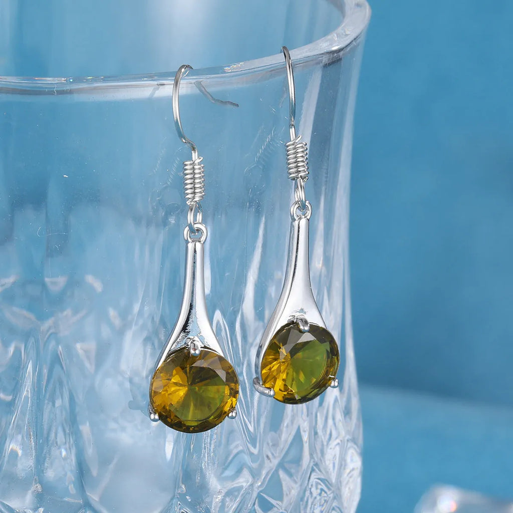 Olive green topaz earrings with water drop shape and retro style design