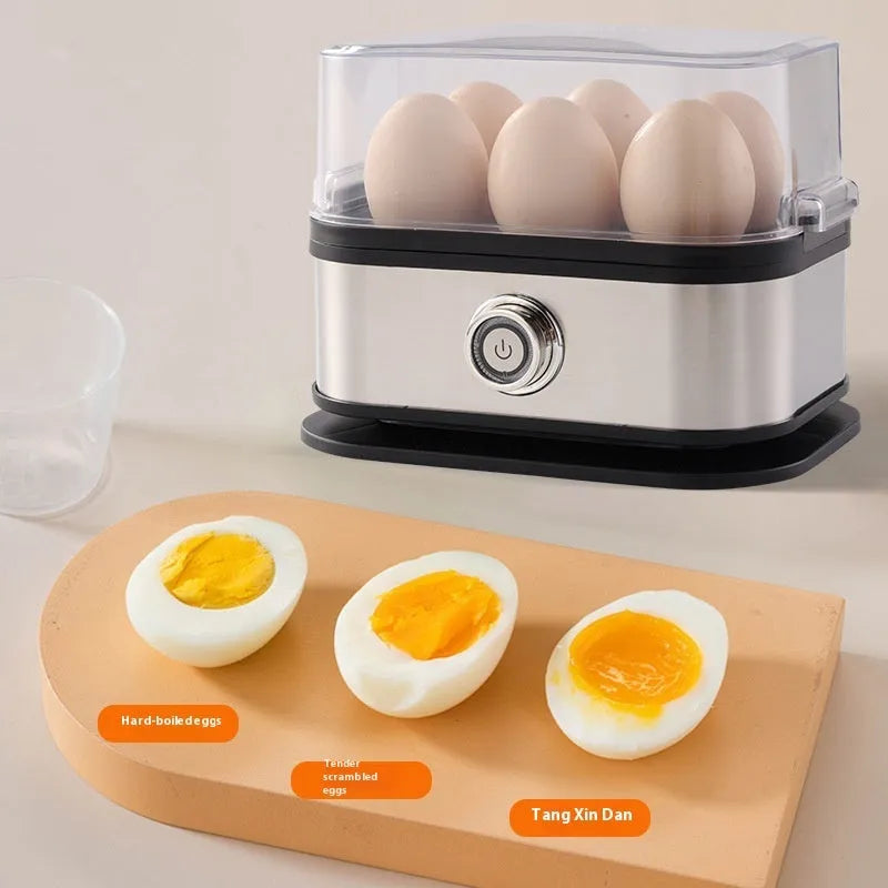 Black stainless steel portable egg boiler with a carry belt on a white background.