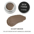 Phoera Eyebrow Cream in six colour shades with double-ended brush, taupe and soft brown pots visible