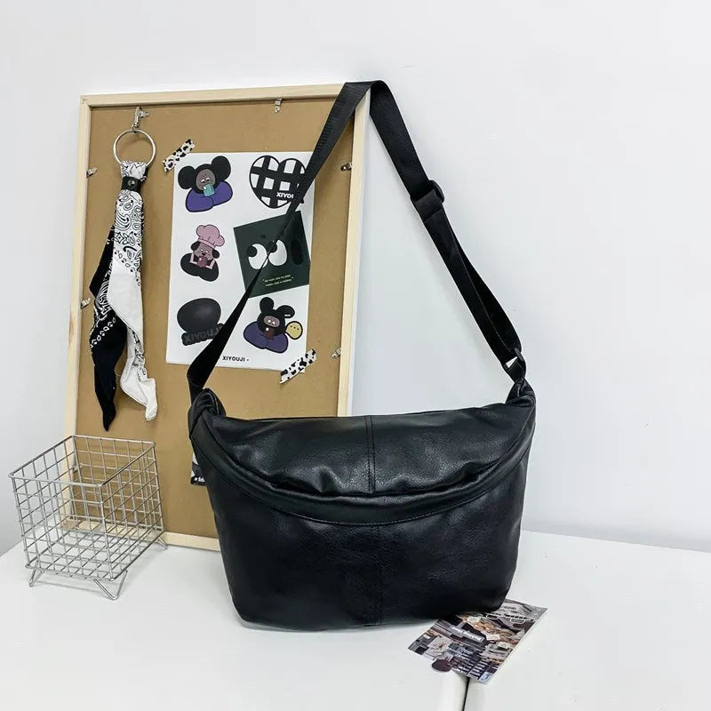 Retro large capacity men's crossbody bag in brown PU leather with zipper closure on white background.