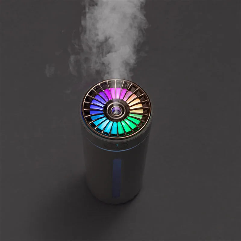 Black and white rechargeable USB humidifier with colourful lights for car and desk use.