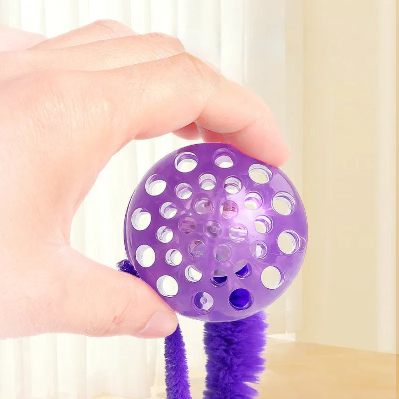 Interactive cat toy with three bouncy TPR balls connected to long plush tail in green colour
