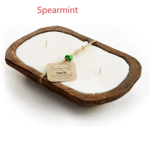 Lavender-coloured wooden basin containing a soy wax aromatherapy candle with three wicks.