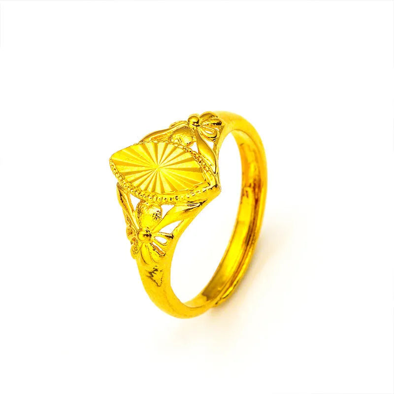 Gold geometric flower ring with open diamond design and textured surface on brass base