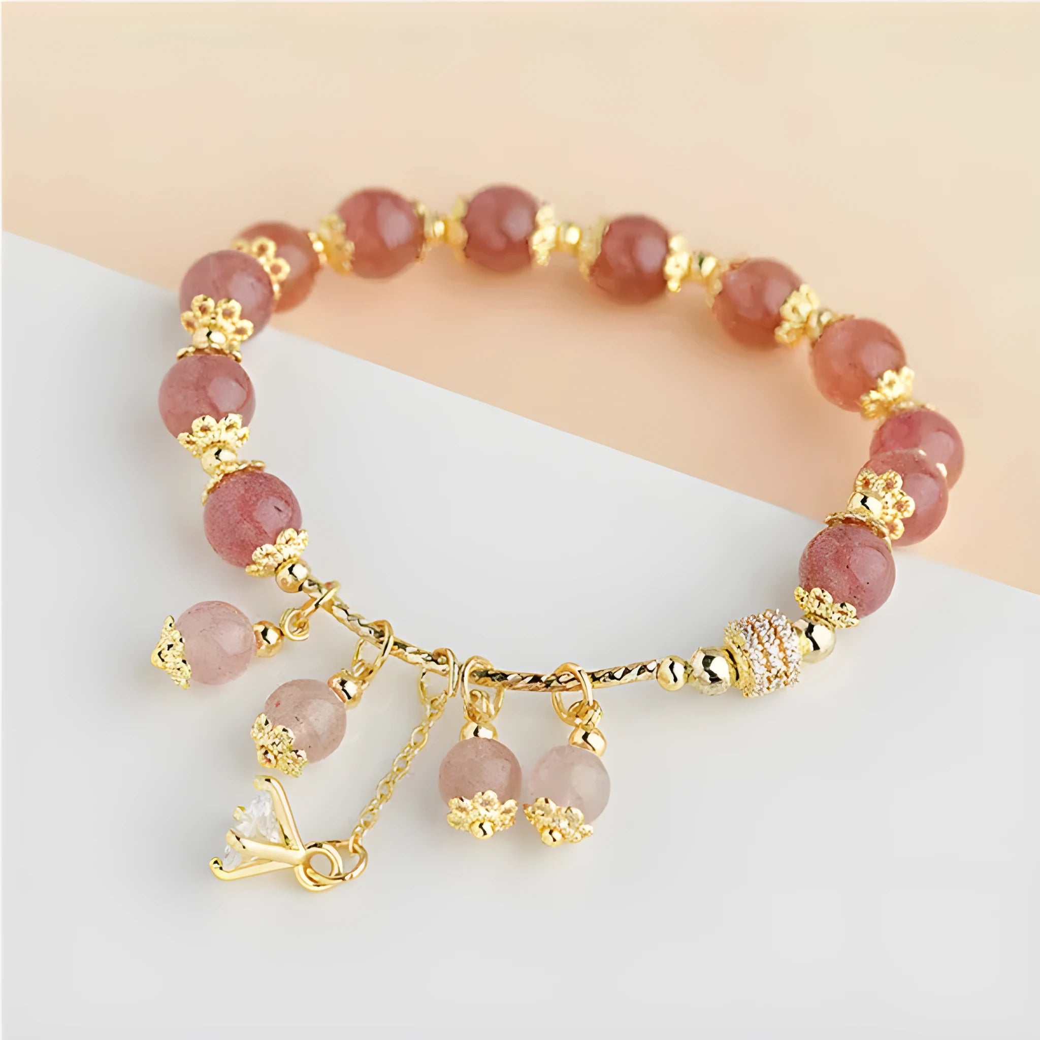 Pink adjustable women's bracelet with heart-shaped strawberry quartz crystal and freshwater pearl accents