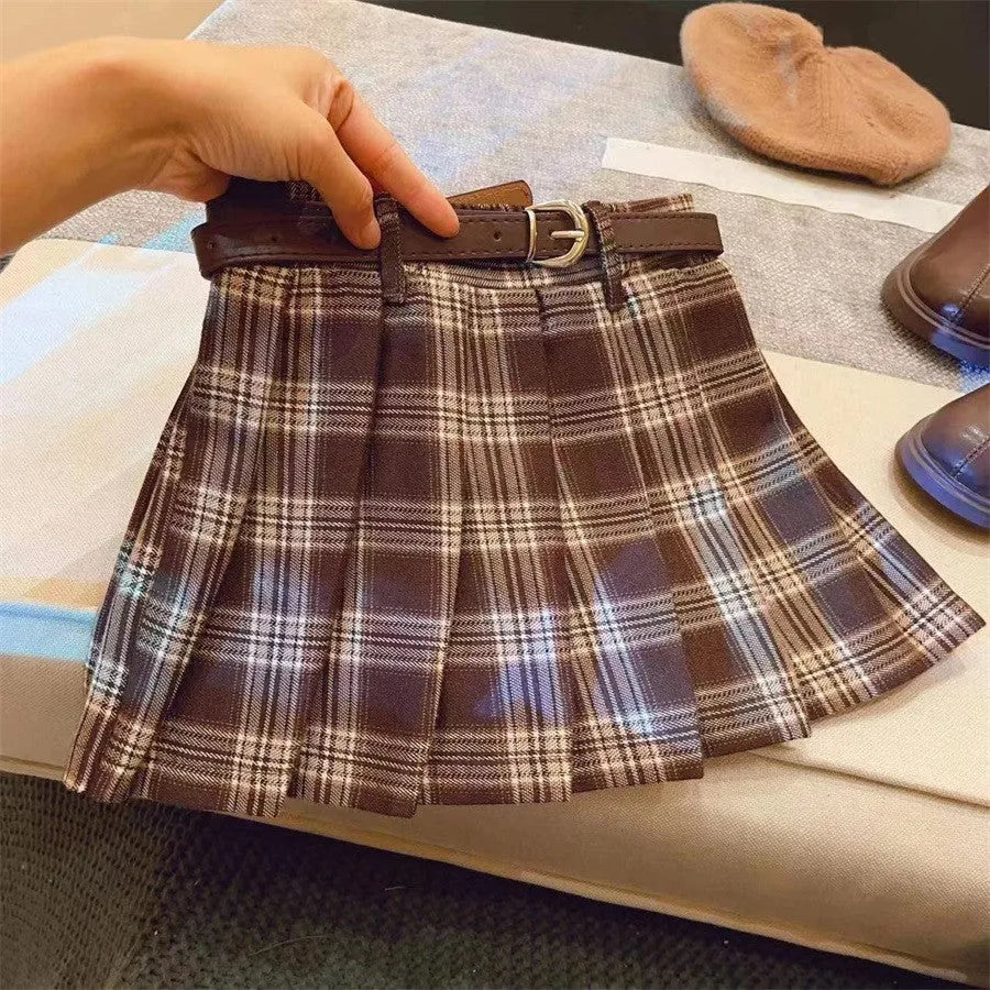 Girls plaid pleated A-line skirt in cotton blend fabric shown in casual setting