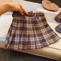 Girls plaid pleated A-line skirt in cotton blend fabric shown in casual setting
