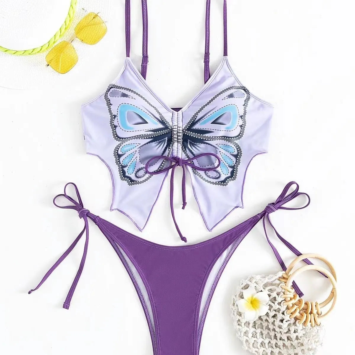 Women's purple bow ins style split bikini set with sleeveless top and briefs for swimming.