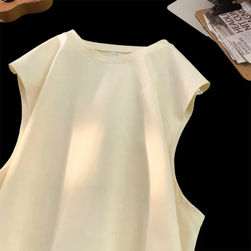 Men's loose fit sleeveless cotton tank top in solid colour on a hanger