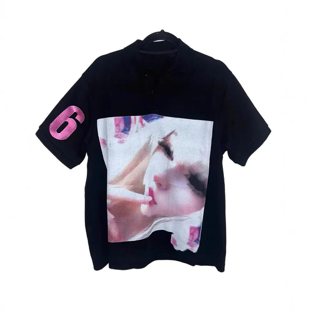 Short-sleeved printed polo shirt in polyester fabric on a hanger