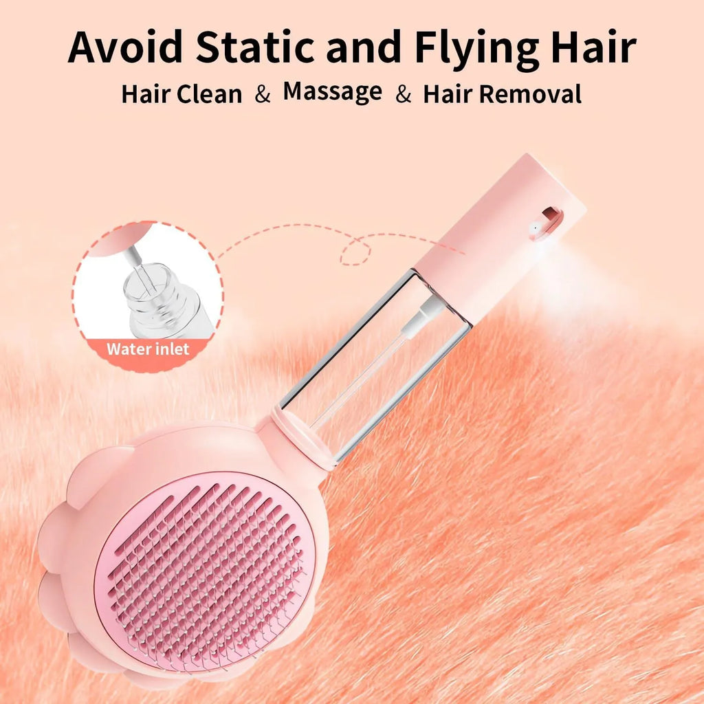 Grey self-cleaning cat brush with spray function and stainless steel bristles on a white background.