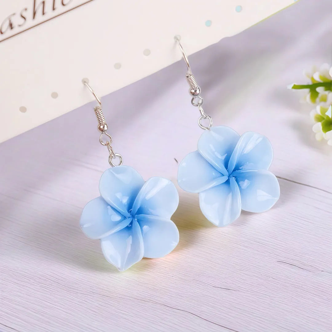 Handmade plastic resin earrings shaped like plumeria rubra flowers in a pair with multiple colour options
