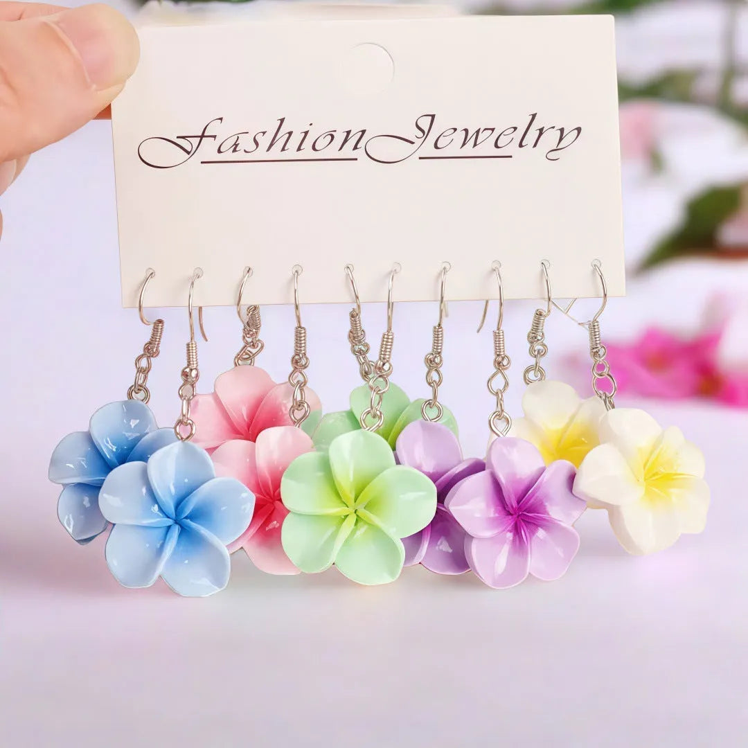 Handmade plastic resin earrings shaped like plumeria rubra flowers in a pair with multiple colour options