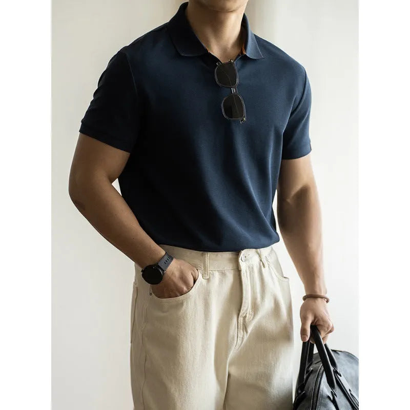 Blue American-style short-sleeved cotton blend polo shirt laid flat, showing regular fit and button placket.