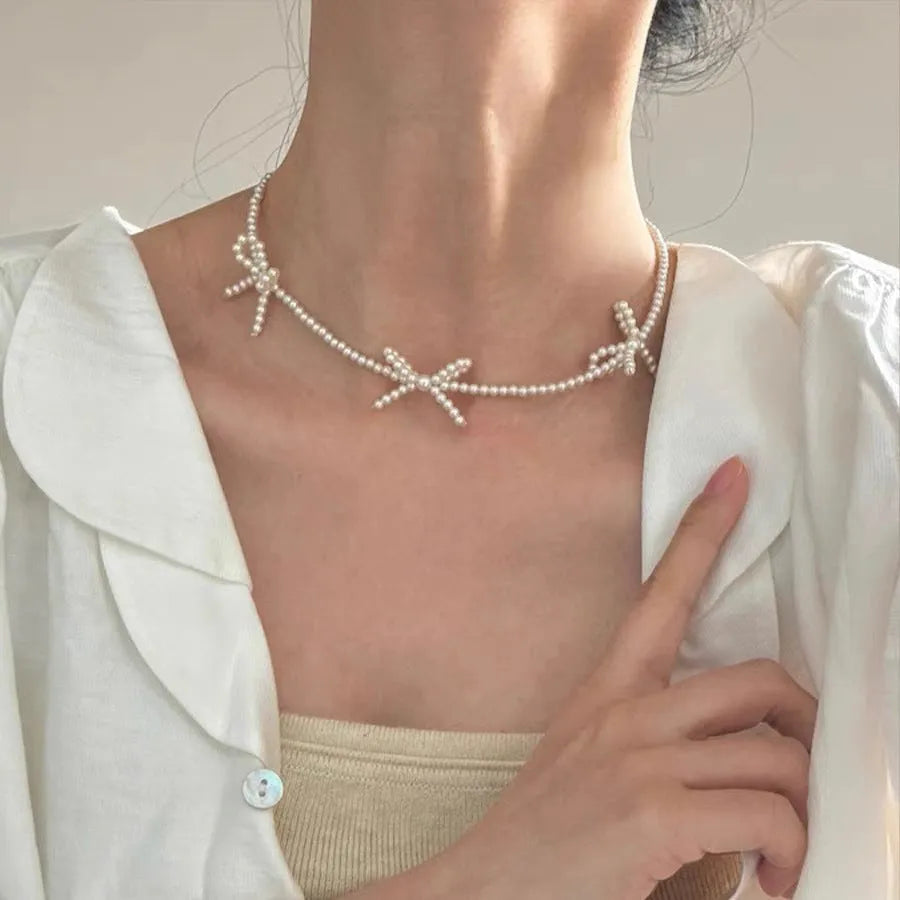 Women's sweet bow pearl necklace with geometric design on adjustable 31-40cm chain