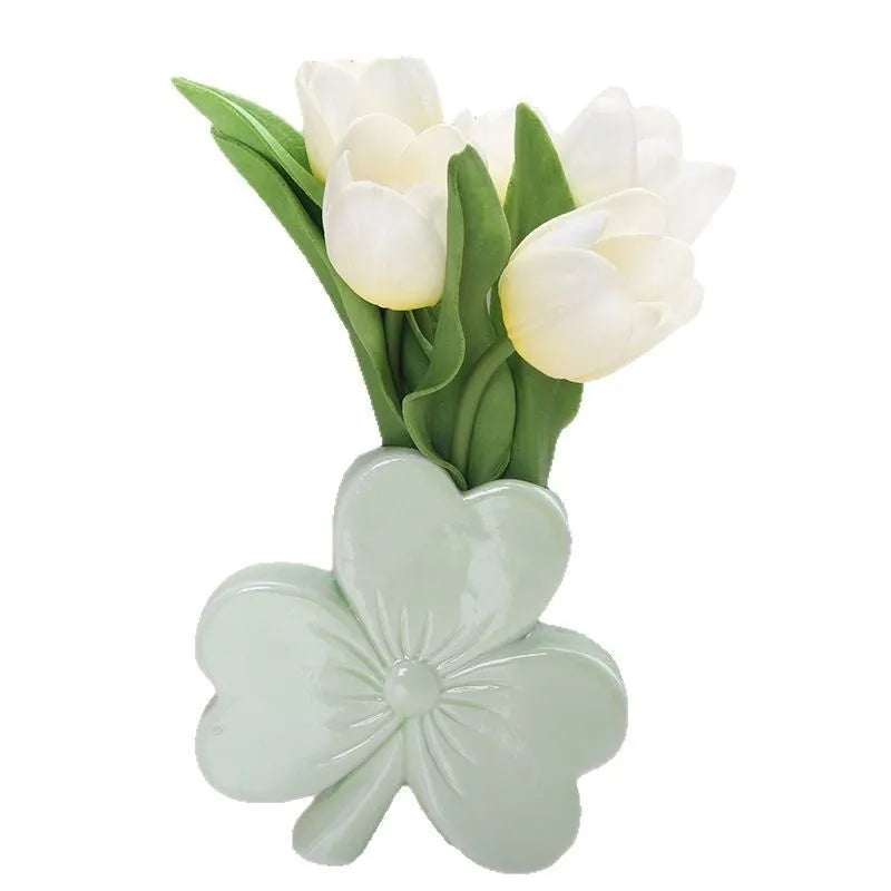 European style white porcelain ceramic vase on a desktop, shown in light green colour.
