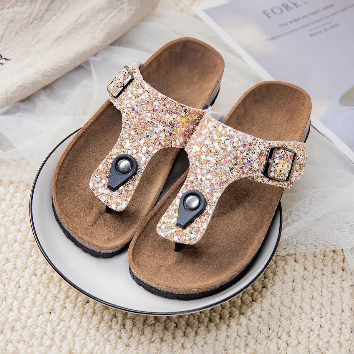 Women's cork flip-flops with frosted metallic artificial leather upper and textured PVC sole.