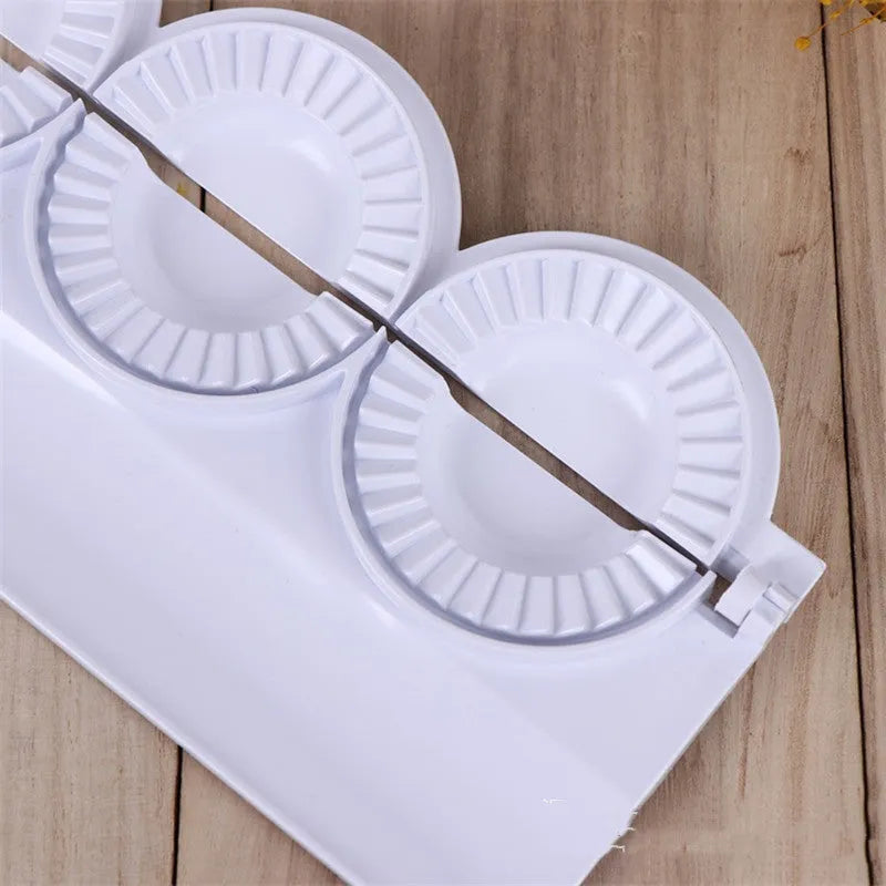 Pure white ABS plastic dumpling maker on a kitchen counter, compact design, modern simple style