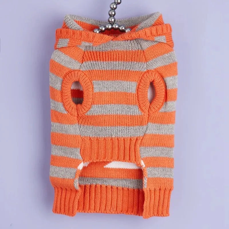 Orange striped knitted Halloween pet sweater with a hood and fur ball decoration for cats or small dogs.