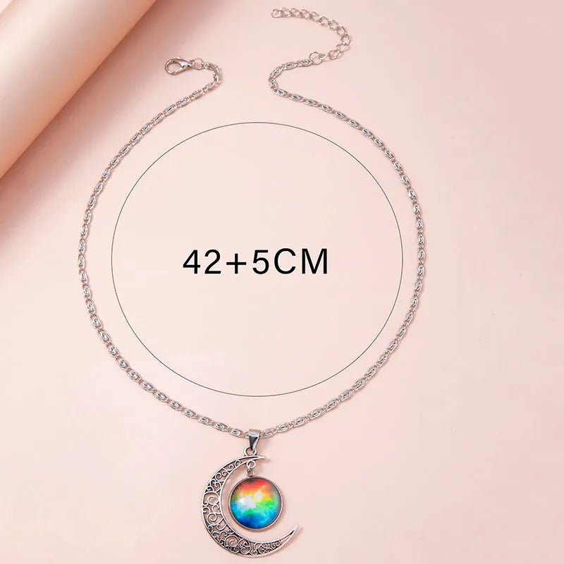 Silver hollow moon pendant necklace with glass star insert on Figaro chain for women