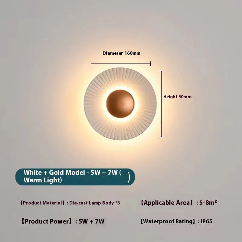 Round aluminium LED wall lamp in a dual-colour finish mounted on a wall.