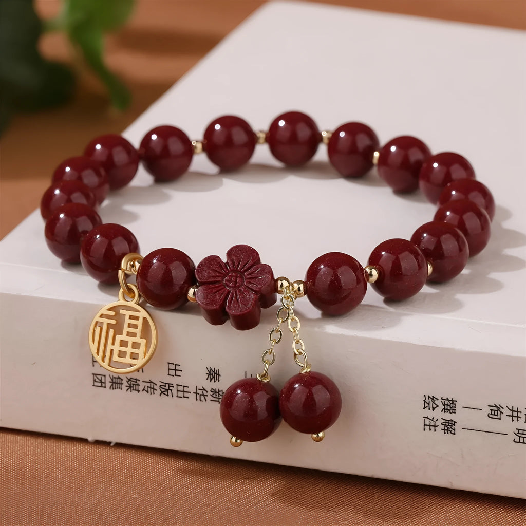 Women's cinnabar bracelet with purple gold sand colour and Fu character design elements