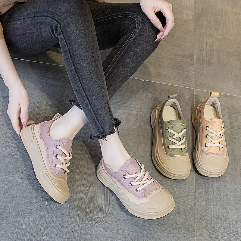 Women's leather platform sneakers in matcha green, side view showing round toe and lace-up design.